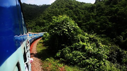 Tracking shot of a train moving in the Araku Valley, Visakhapatnam, Andhra Pradesh, India