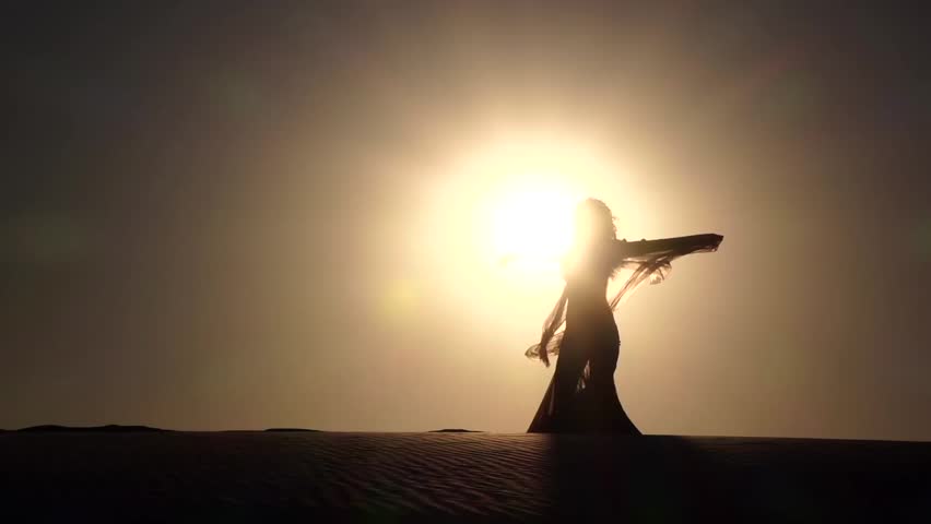 Dancer makes sexual movements with her body. Silhouette. Slow motion
