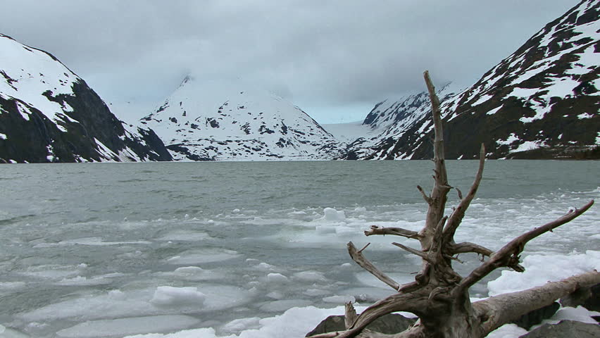 A cloudy and windy day at Portage Lake in Alaska, this view of ice chunks on the