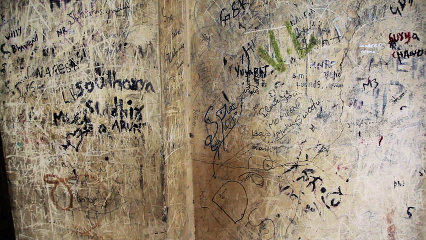 Tilt up shot of text written on the wall in Golkonda Fort, Hyderabad, Andhra Pradesh, India
