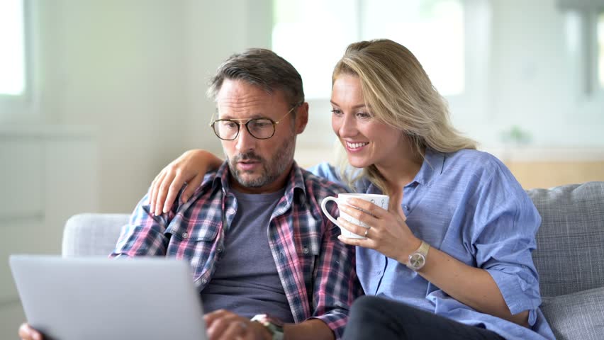 Mature couple connected on internet with laptop Royalty-Free Stock Footage #31152280