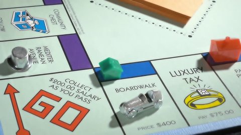BOSTON, MA - SEPT 27: Playing Monopoly board game on September 27, 2017. Monopoly has become a part of popular world culture, having been locally licensed in more than 103 countries. 