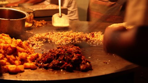 Locked-on shot of a chefs preparing food, Khau Galli, Mumbai, Maharashtra, India