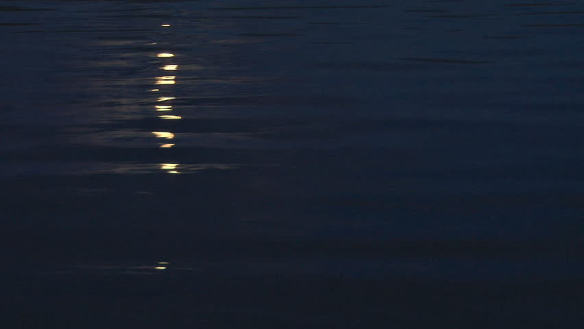 A clip of subtlety, a nightshot in which the rising moon is reflected on the