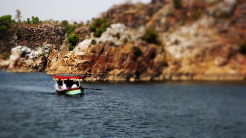 Pan shot of tourists enjoying boat riding, Jabalpur, Madhya Pradesh, India