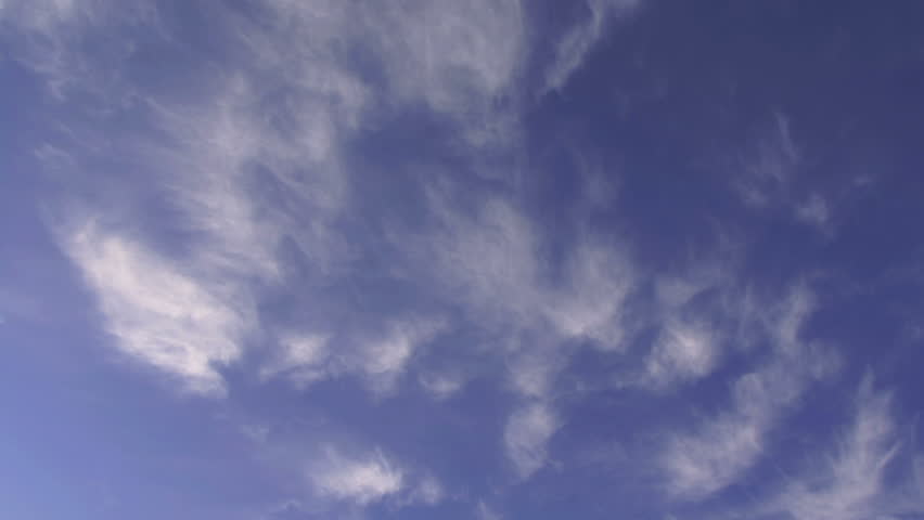 Wispy clouds in timelapse, blue sky.