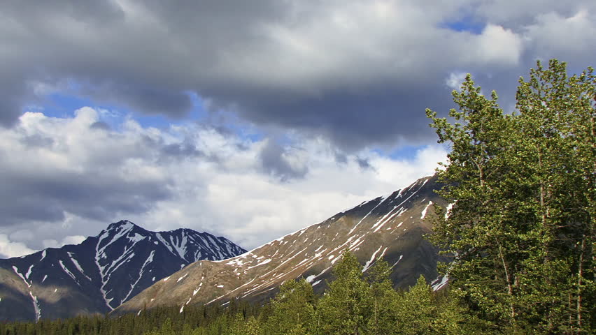 Windy Stormclouds over Alaskan Mountains with Tree