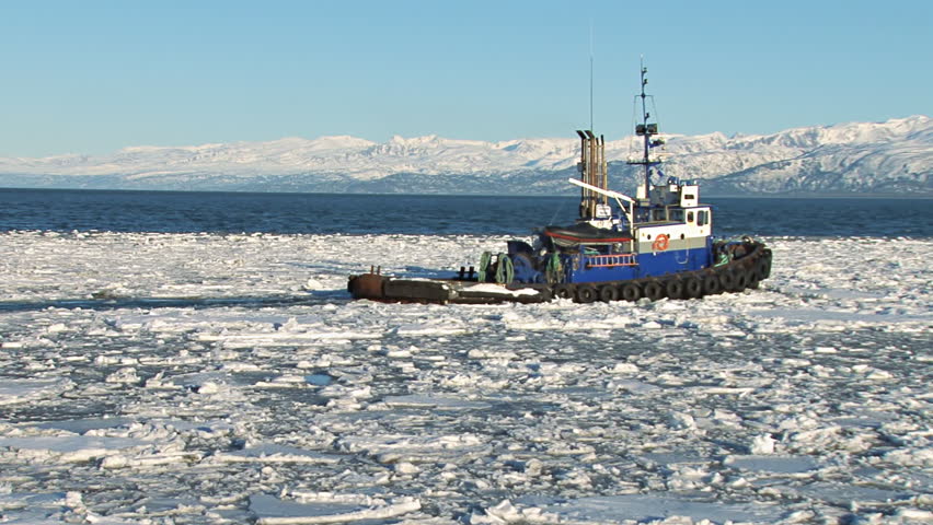 Tugboat Redoubt Leaving Icy Harbor