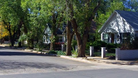 FLAGSTAFF, AZ - OCTOBER 7, 2012: A row of wooden houses on a tree lined street in a quiet neighborhood in this small but thriving western USA city- circa 2012 in Flagstaff. 