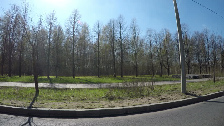 The car moves across the territory of Saint Petersburg State University SPbSU in New Peterhof, a view from the window on educational buildings