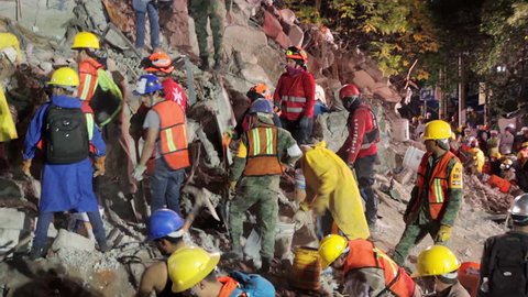 La Roma, Mexico City, Sept 21th 2017. Soldiers, rescuers and volunteers work together to find people alive inside a building collapsed by the earthquake in Mexico City the September 19th.