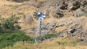 High definition 1080p video of moving windmill aerator structure in high desert in central Oregon 1920x1080 hd