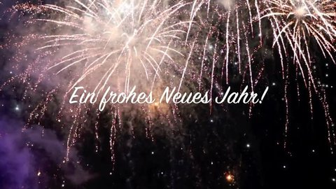 Fireworks video of 20 seconds with beautiful explosions and a text banner saying "Frohes Neues Jahr!" in German language for 8 seconds