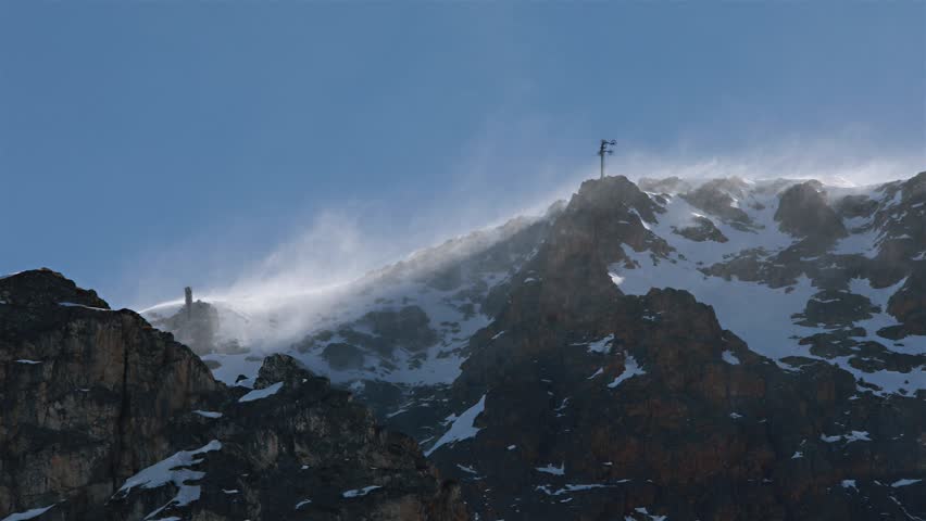 Snow crystals blown in the strong wind
