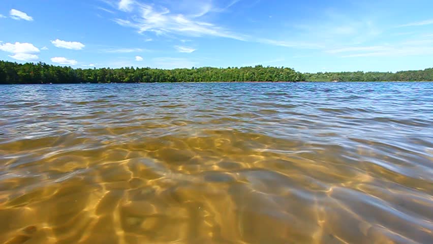 Small ripples on a beautiful swimming beach in a northwoods Wisconsin Lake