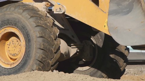 Closeup loader excavator at road construction work