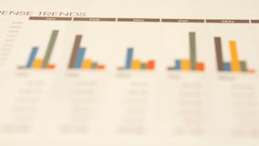 Golden bitcoin and finance reports on office desk motion view close up - Powered by Shutterstock - Get 15% off with code: PIKWIZARD15