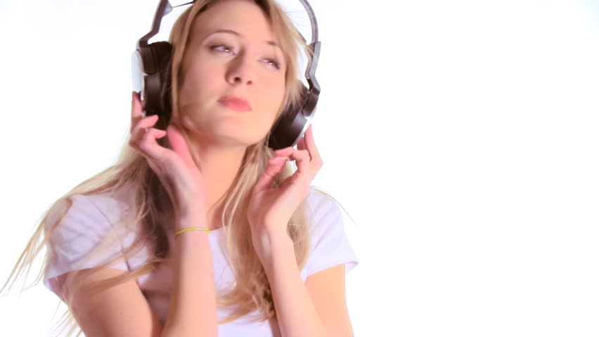 Beautiful woman listening to music on headphones