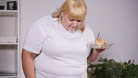 fat woman eating a burger and looking at the scales, slow motion