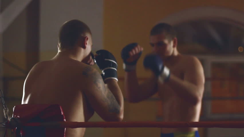 Two men sparring on ring
