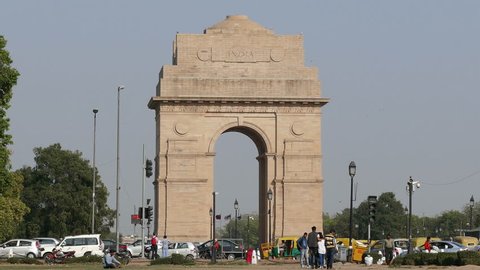 NEW DELHI, INDIA - MARCH, 2017: tourists visit to India Gate on March, 2017. India Gate was built to memorialize the Indian soldiers who lost their lives during the First World War. 