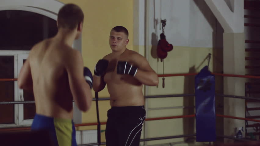 Two men sparring on ring