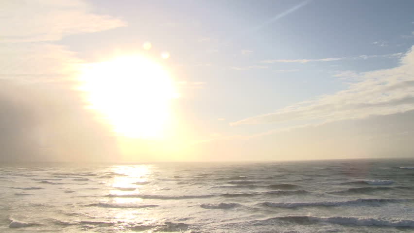 Bright sun shines over the Pacific Ocean on beautiful day.