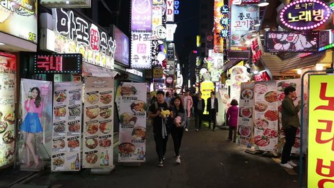 SEOUL, SOUTH KOREA - MAY 9, 2017: A crowd of Korean people wandering around the nightlife district of Insadong famous for its bright lights in the heart of Seoul, South Korea capital city. 