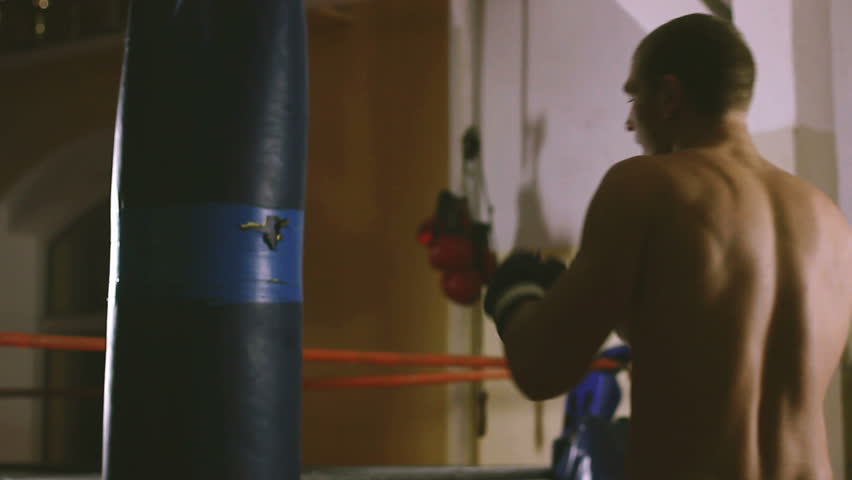 Young boxer trains on punching bag