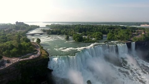 Spectacular flyover footage from the sky approaching, Niagara Falls from the most recognized and stunning view.