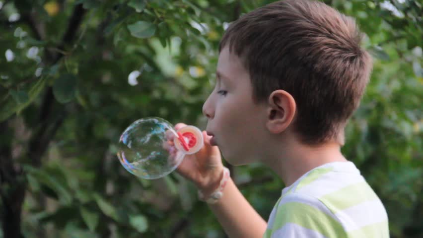 blowing soap bubbles