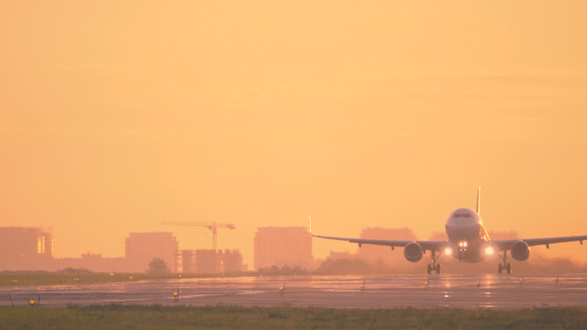 Airplane taking off at dawn. Aircraft takes off at sunset. Long shot  Royalty-Free Stock Footage #31217416