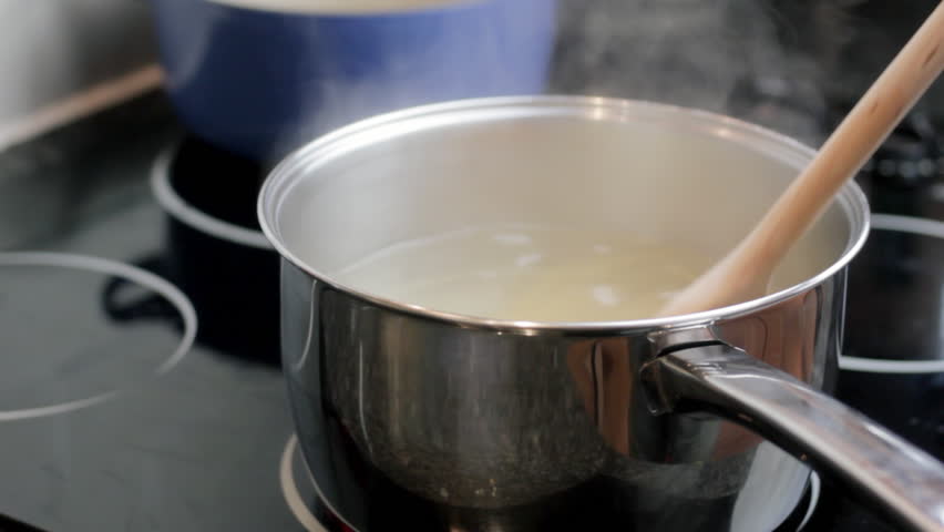 Stirring pan of pasta