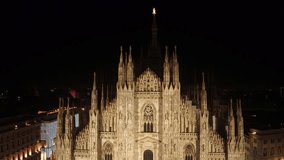 Aerial drone footage view of cathedral dome in Milan italy by night // no video editing