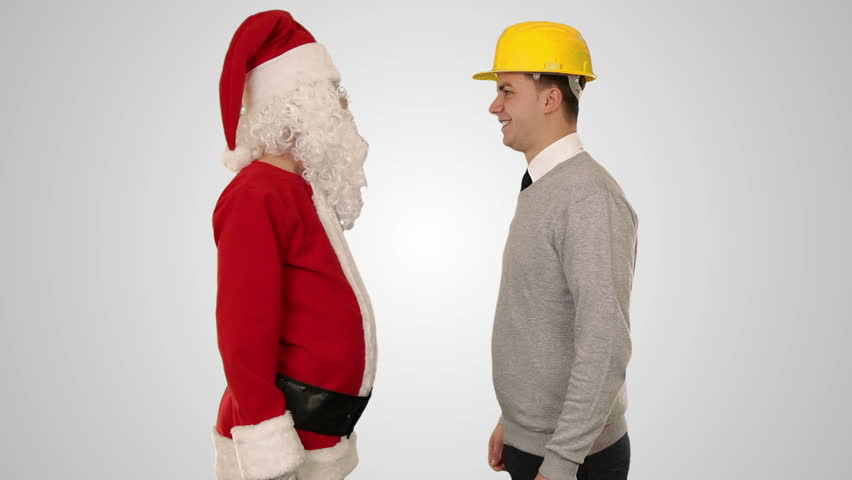 Santa Claus and Young Architect against white, shaking hands and looking at