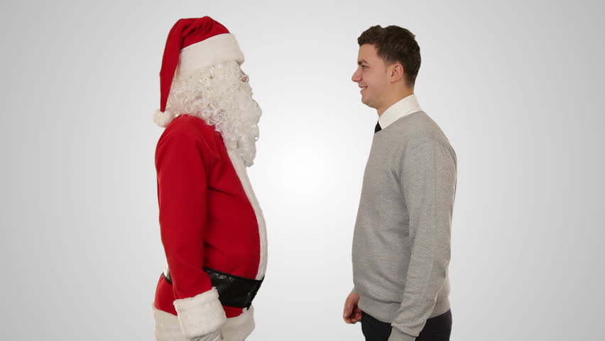 Santa Claus and Young Businessman against white, shaking hands and looking at