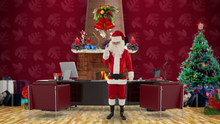 Santa Claus talking on mobile in his modern Christmas Office