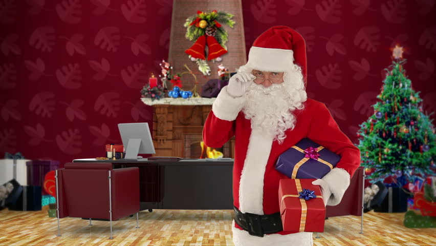 Santa Claus holding presents in his modern Christmas Office