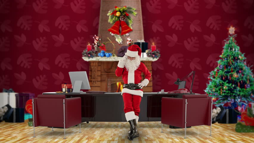 Santa Claus on mobile in his modern Christmas Office