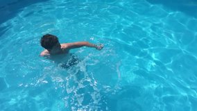 bathe in the pool water. children boy and girl swimming in the pool playing kids slow motion video