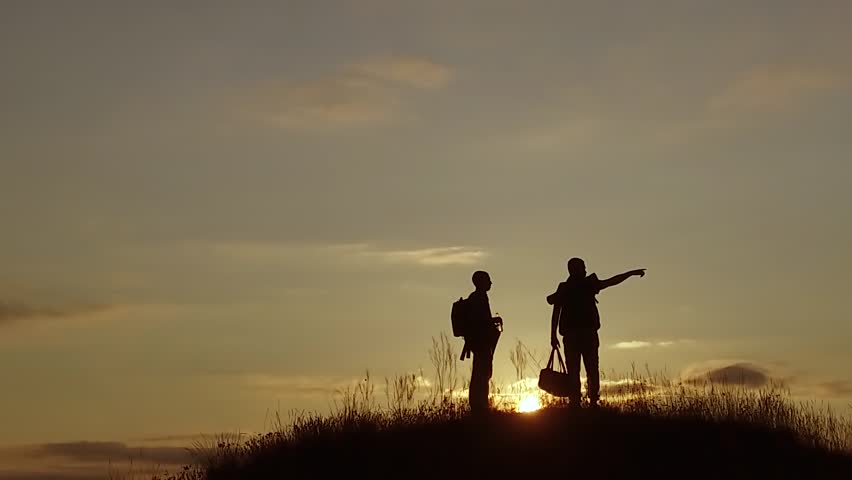people tourists. people group of tourists walking on top of a travel sunset silhouette mountain. slow motion video nature tourists people group go