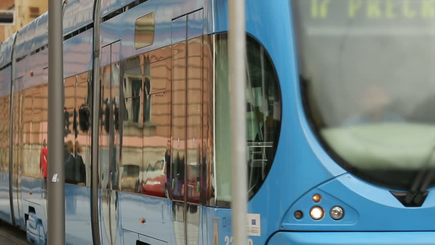 Public transport in big city, modern tram carrying passengers, Zagreb streets