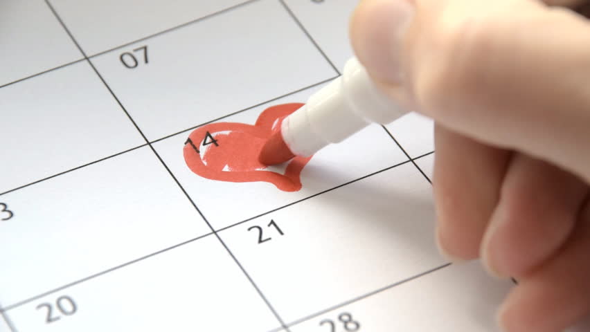 Writing RED HEART on 14th February on calendar with a red marker. The concept of Valentine's day Royalty-Free Stock Footage #31239466