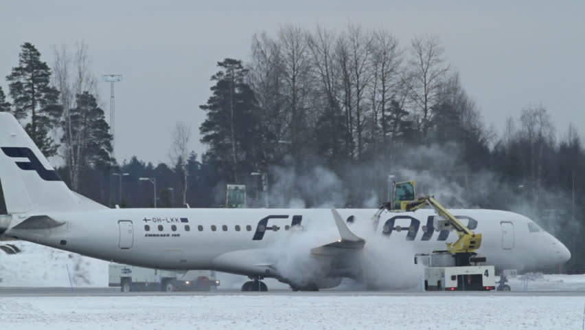 OSLO, NORWAY - DEC 6: Winter, cold weather at OSL Airport, Oslo Norway. Airplane