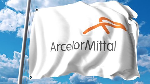 Waving flag with ArcelorMittal logo against clouds and sky. 4K editorial animation