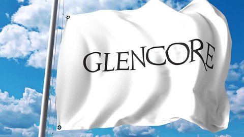 Waving flag with Glencore plc logo against clouds and sky. 4K editorial animation