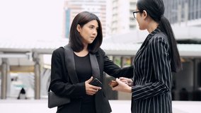 Young generation business team not working together concept. Young business intern Asian woman having very serious fight and arguments with her Asian female manager, dramatic expression. Medium shot. - Powered by Shutterstock - Get 15% off with code: PIKWIZARD15