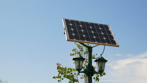 Beautiful street lamp with solar battery in the city park, 4k video