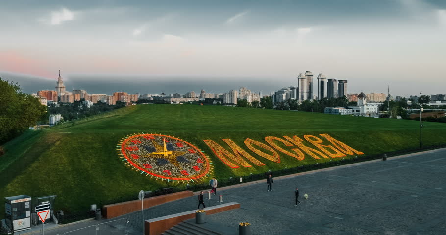 Moskva and clock written with flowers in Victory Park