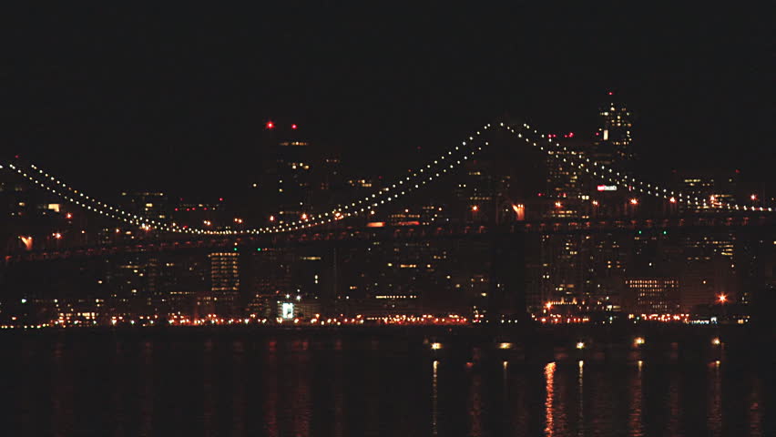 San Francisco as seen at night through the Bay Bridge, static shot taken from